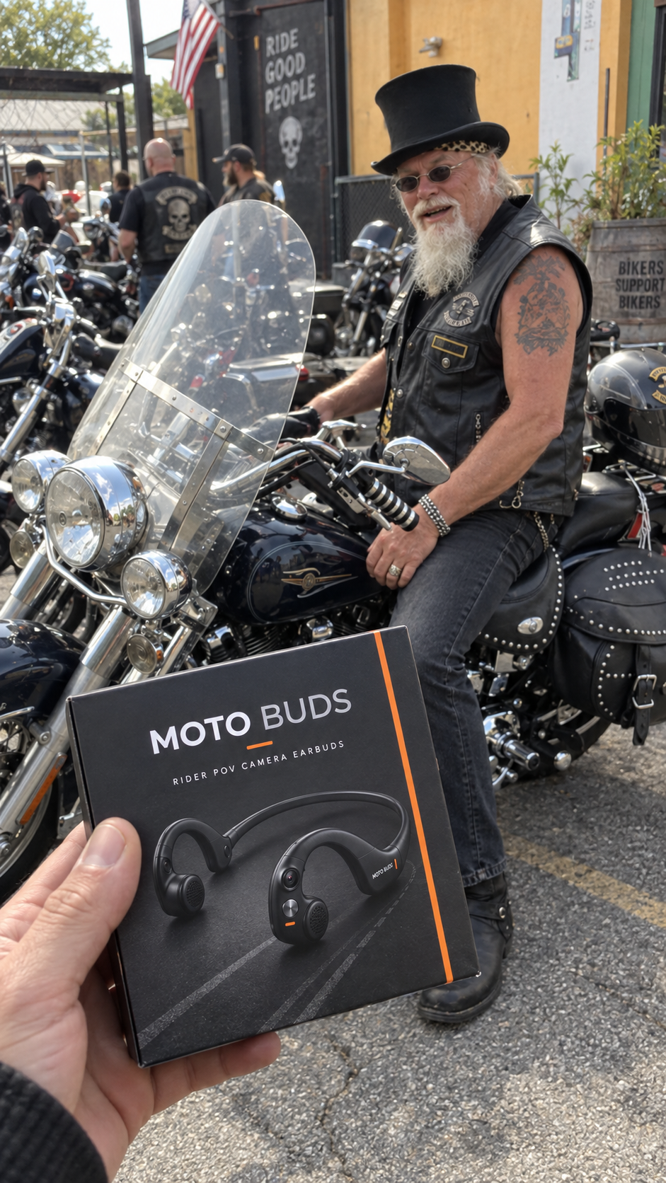 Older motorcycle rider receiving Moto Buds at a biker gathering